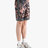 Pink shorts worn by a person, showing the shorts fit 