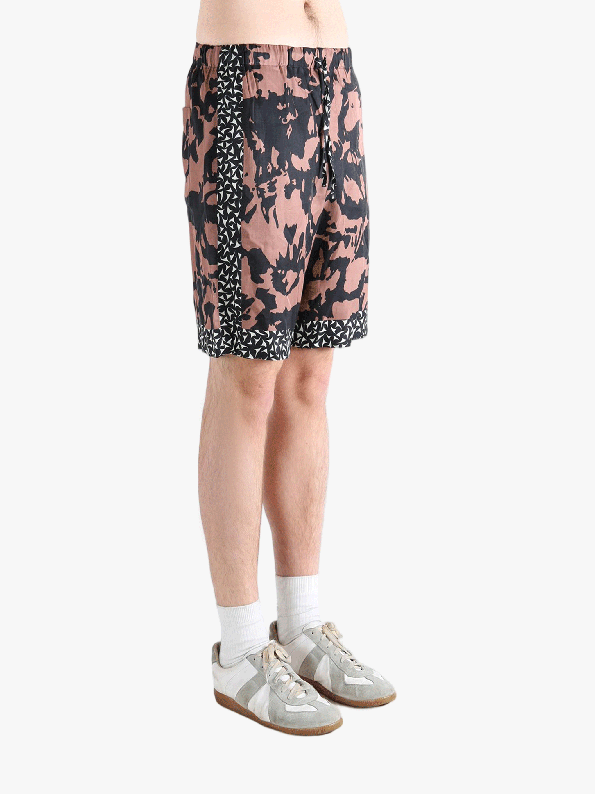 Pink shorts worn by a person, showing the shorts fit 