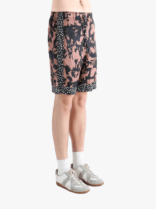 Pink shorts worn by a person, showing the shorts fit 