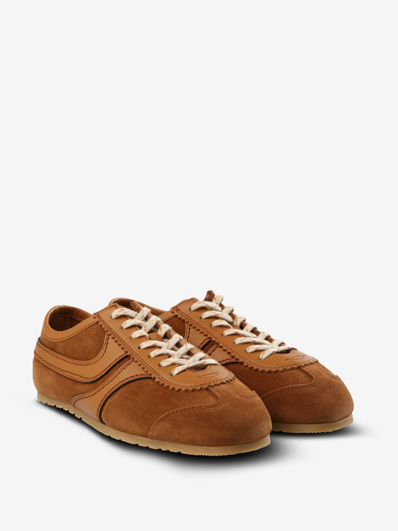 Tan sneakers, side view