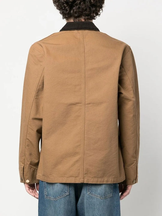 Tan coat worn by a person, showing the coat's fit