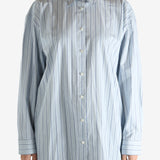 Blue shirts worn by a person, showing the shirts fit