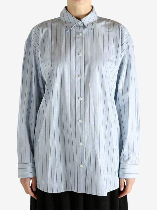 Blue shirts worn by a person, showing the shirts fit