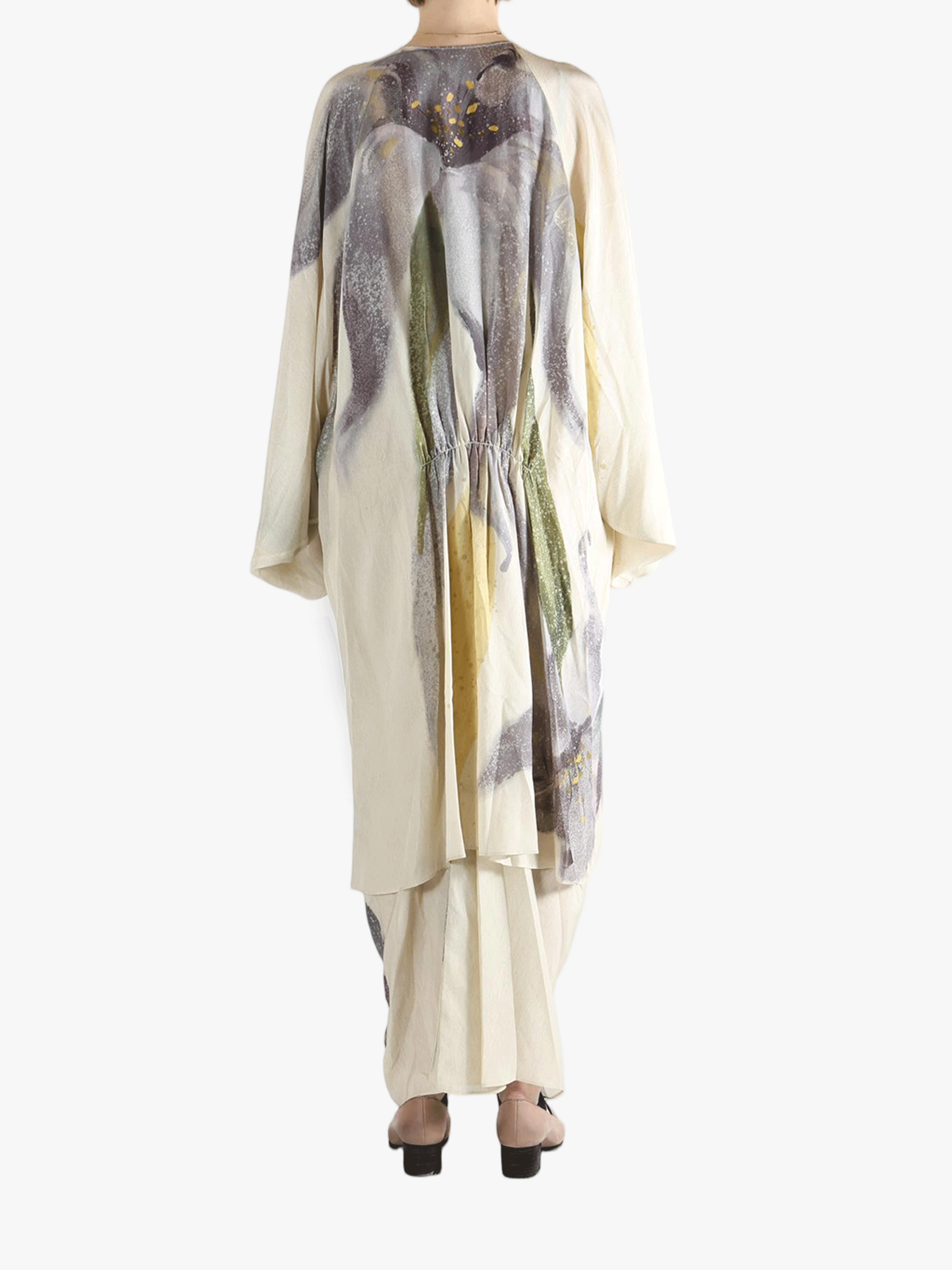 Tan top worn by a person, showing the top's fit