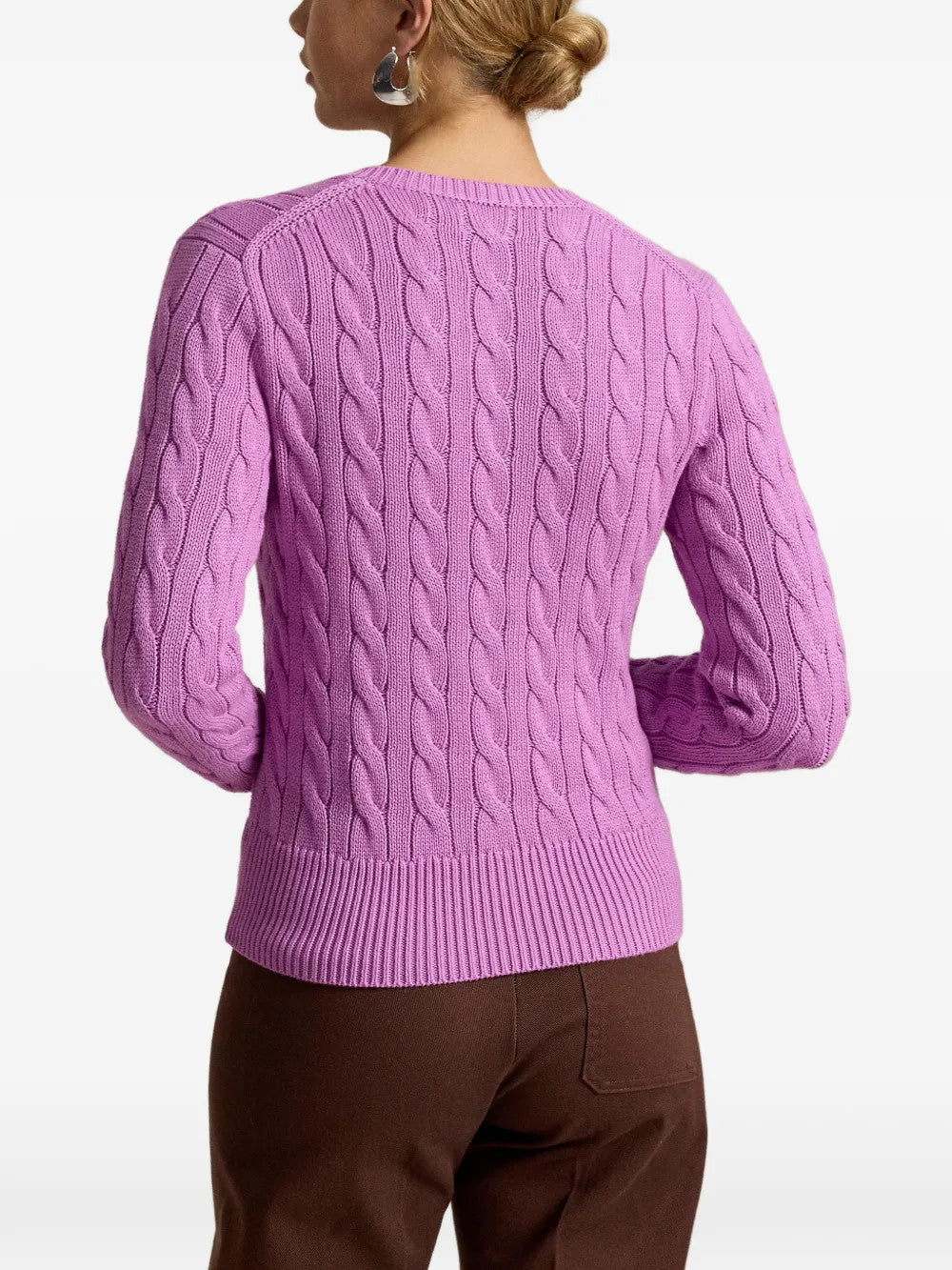 Purple knitwear worn by a person, showing the knitwear fit
