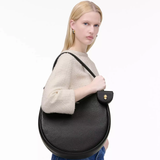 Black bag worn by a person, showing the bag's fit