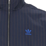 Close up of Navy jacket, showing texture of the 88% recycled polyester/ 12% polyester made in fabric