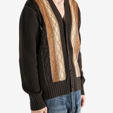 Brown sweater worn by a person, showing the sweater fit