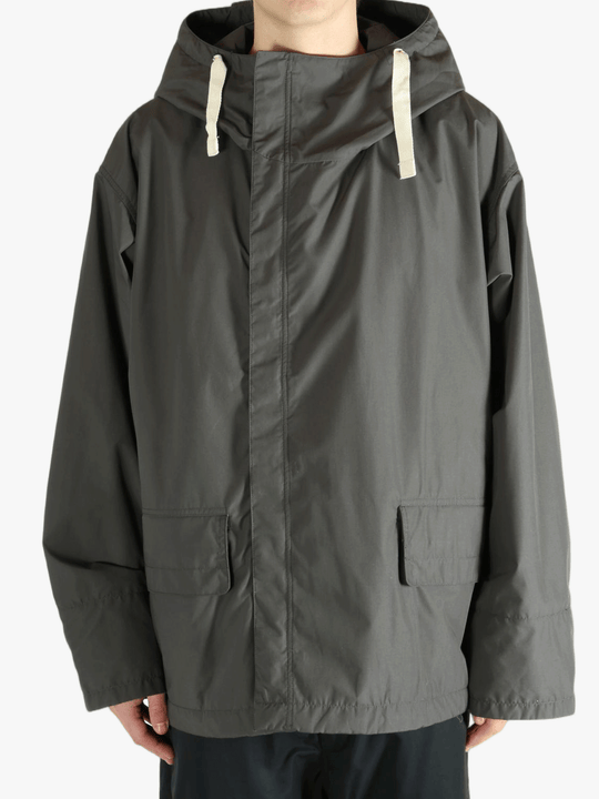 Grey jacket worn by a person, showing the jacket's fit