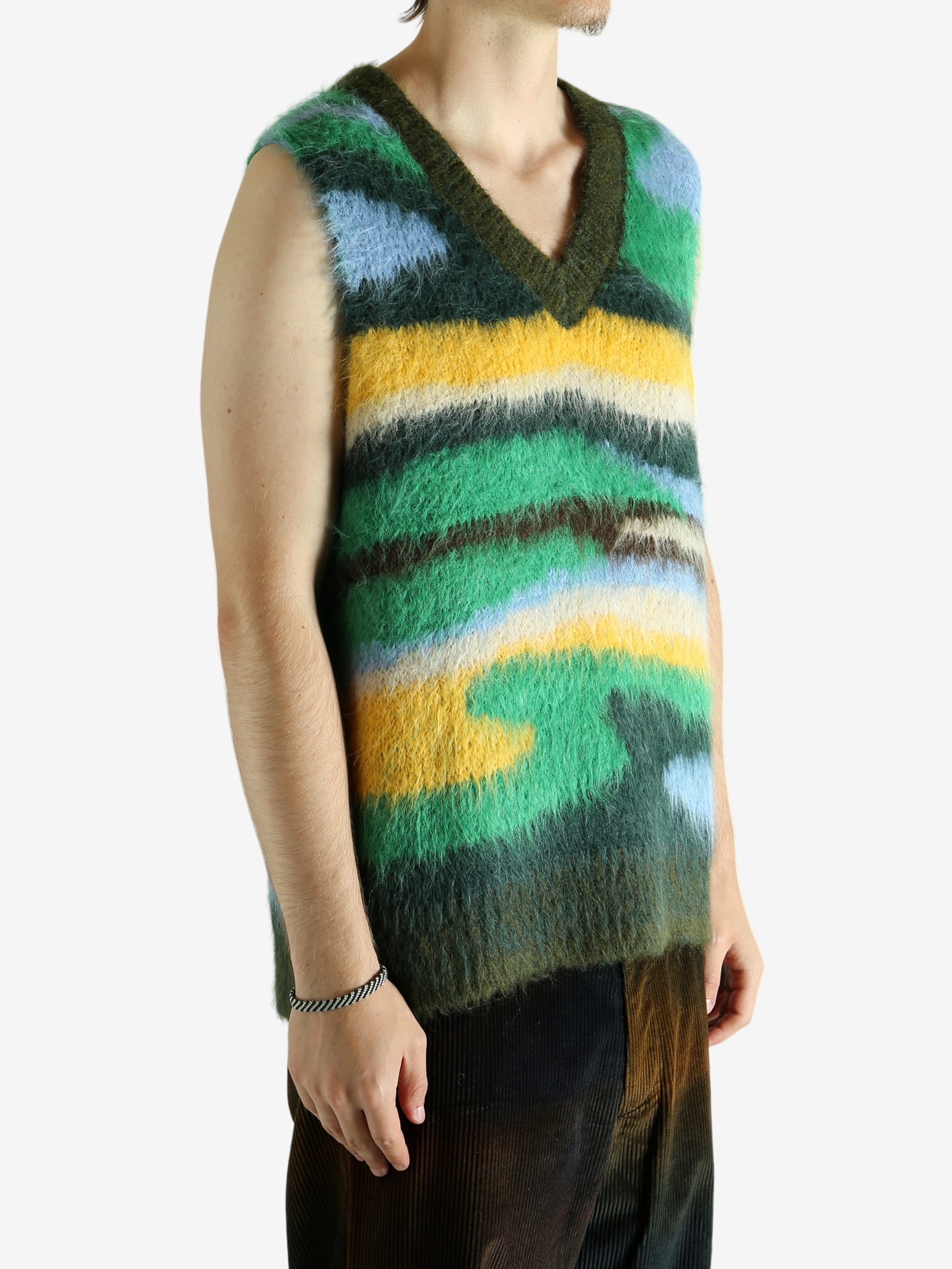 Green vest worn by a person, showing the vest's fit