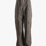 Grey pants worn by a person, showing the pants fit