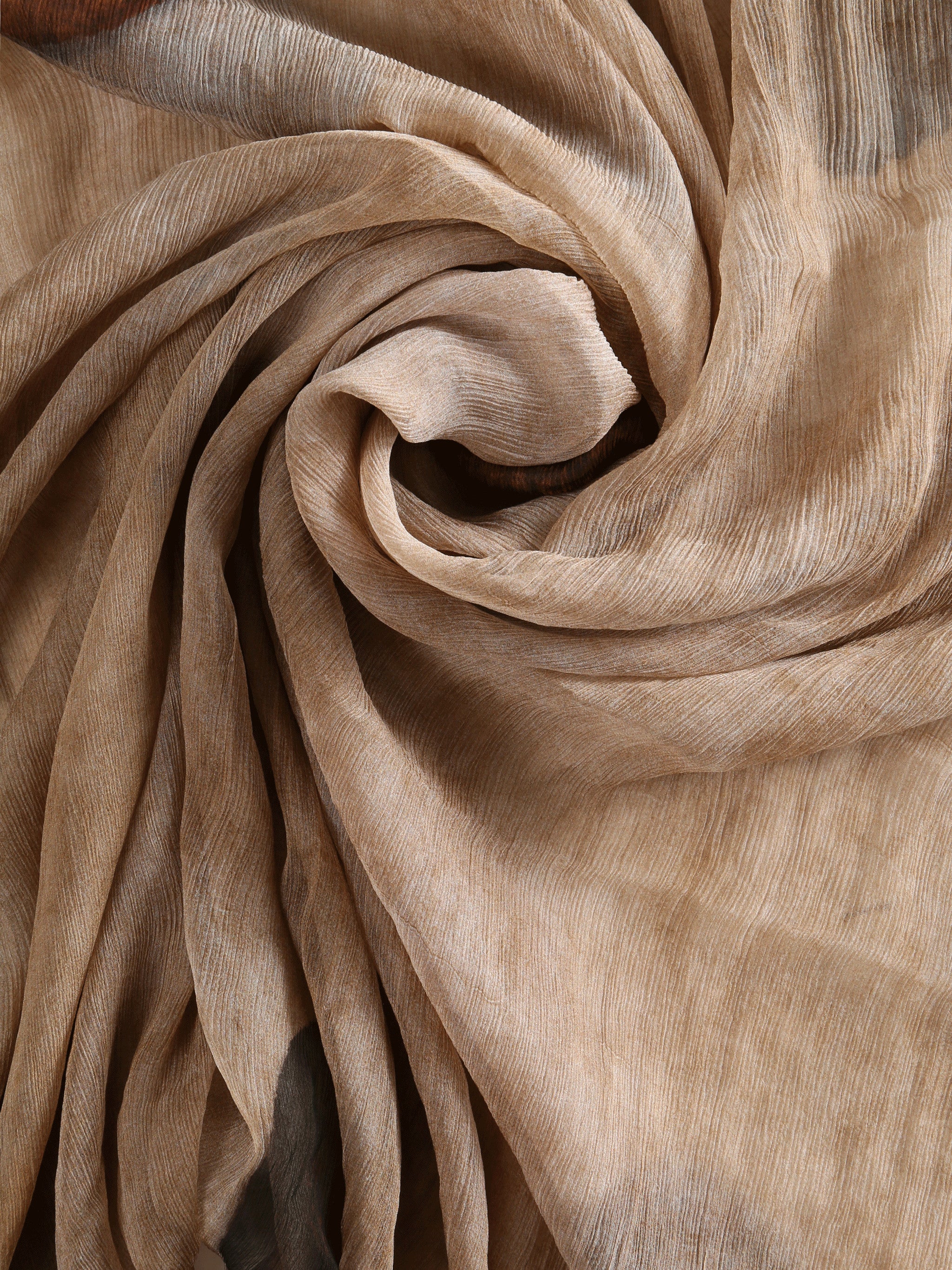 Close up of brown scarf, showing texture of the Virgin Wool fabric