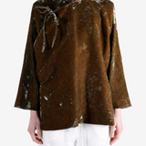 Brown jacket worn by a person, showing the jacket fit