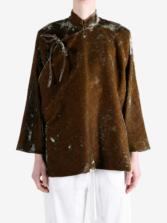 Brown jacket worn by a person, showing the jacket fit
