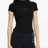 black top worn by a person, showing the top's fit