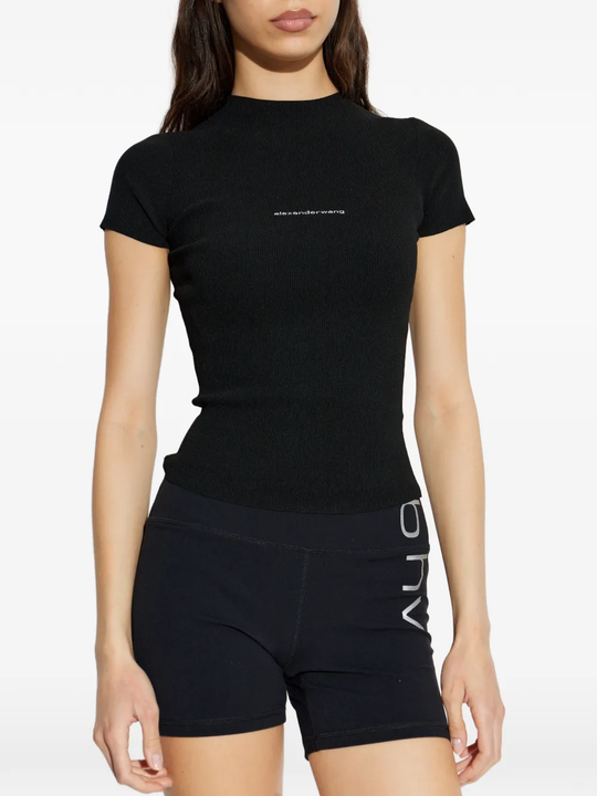 black top worn by a person, showing the top's fit