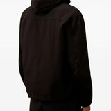 Black jacket worn by a person, showing the jacket's fit