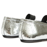 Close up of grey shoes, showing texture of the leather fabric