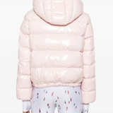 Pink jackets worn by a person, showing the jackets fit