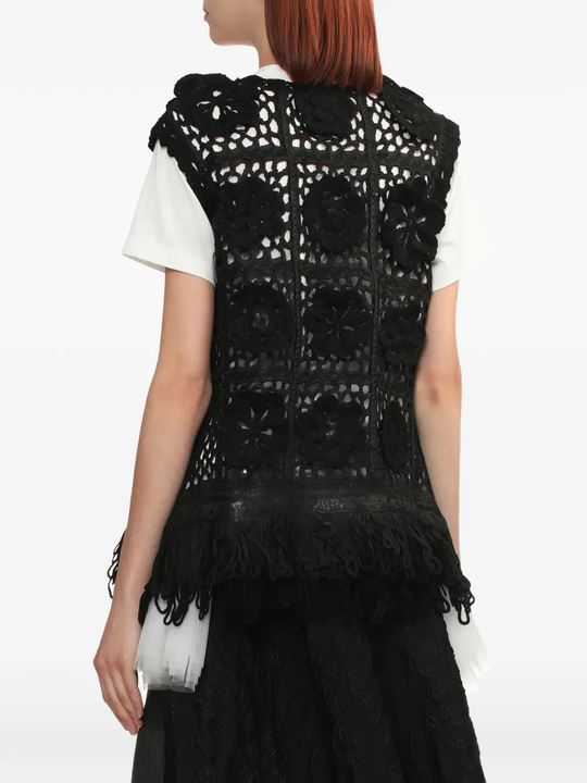 black top worn by a person, showing the top fit