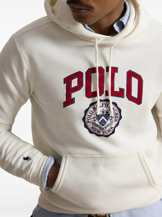 Tan hoodie worn by a person, showing the hoodie fit