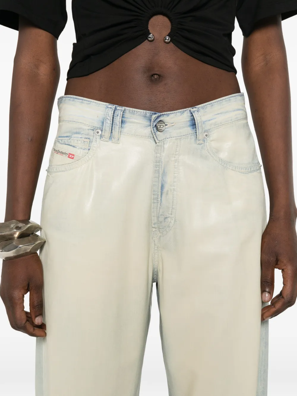 grey pants worn by a person, showing the pants' fit