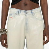 grey pants worn by a person, showing the pants' fit