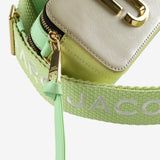 Close up of the green bag, showing texture of the leather fabric