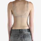 beige ribbed tank top worn by a person, showing the top fit