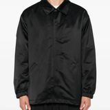 Black jacket worn by a person, showing the jacket fit