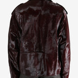 Brown jacket worn by a person, showing the jacket fit