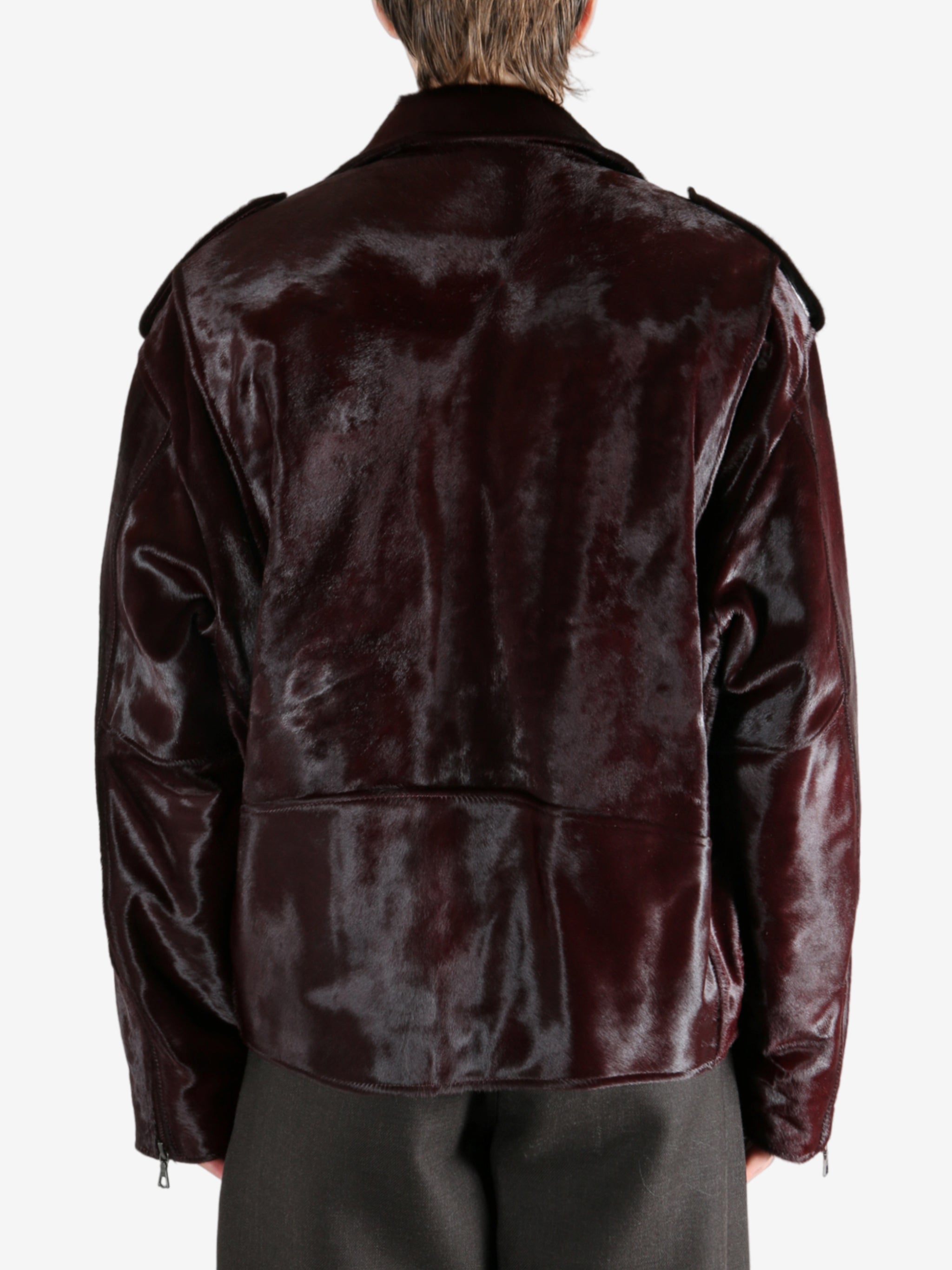 Brown jacket worn by a person, showing the jacket fit