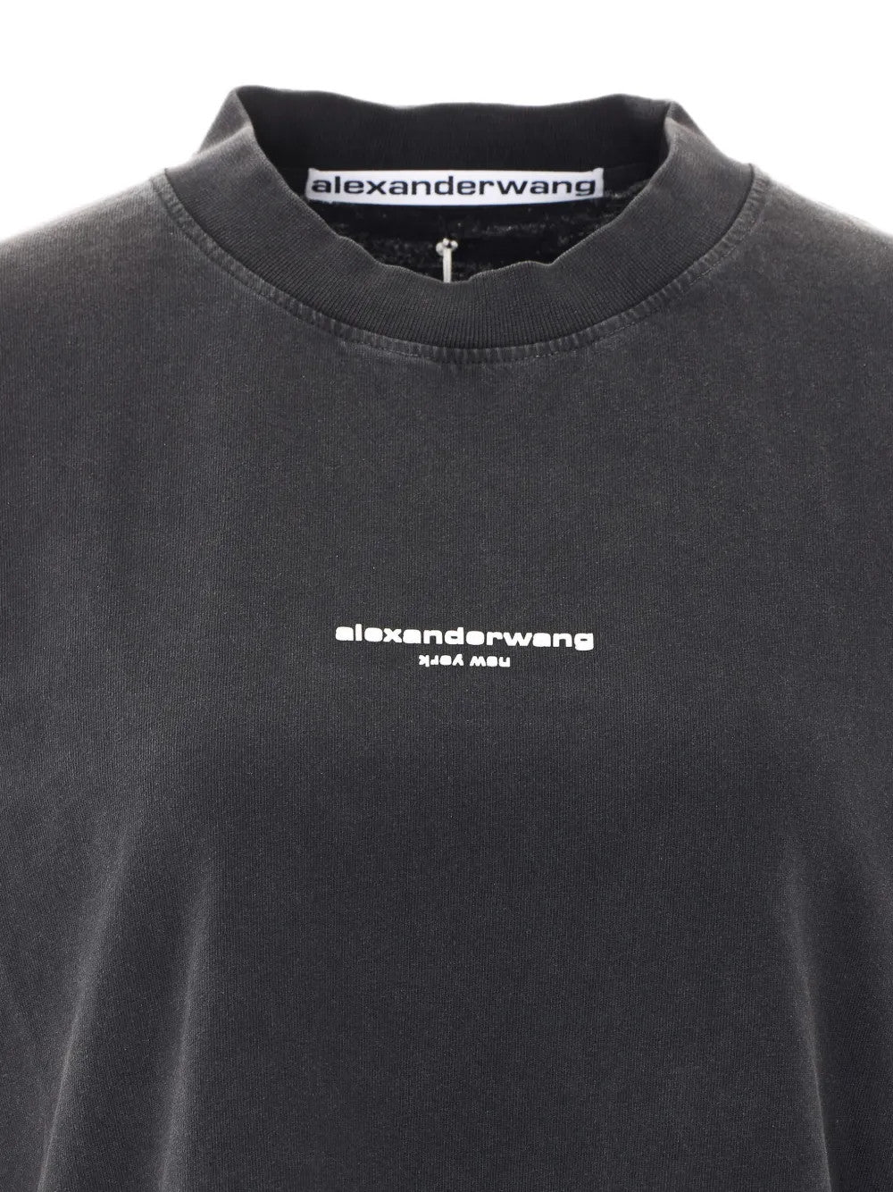 Close up of Black t-shirt, showing texture of the 99% cotton/ 1% elastane fabric