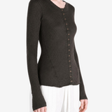 Brown knitwear worn by a person, showing the knitwear fit