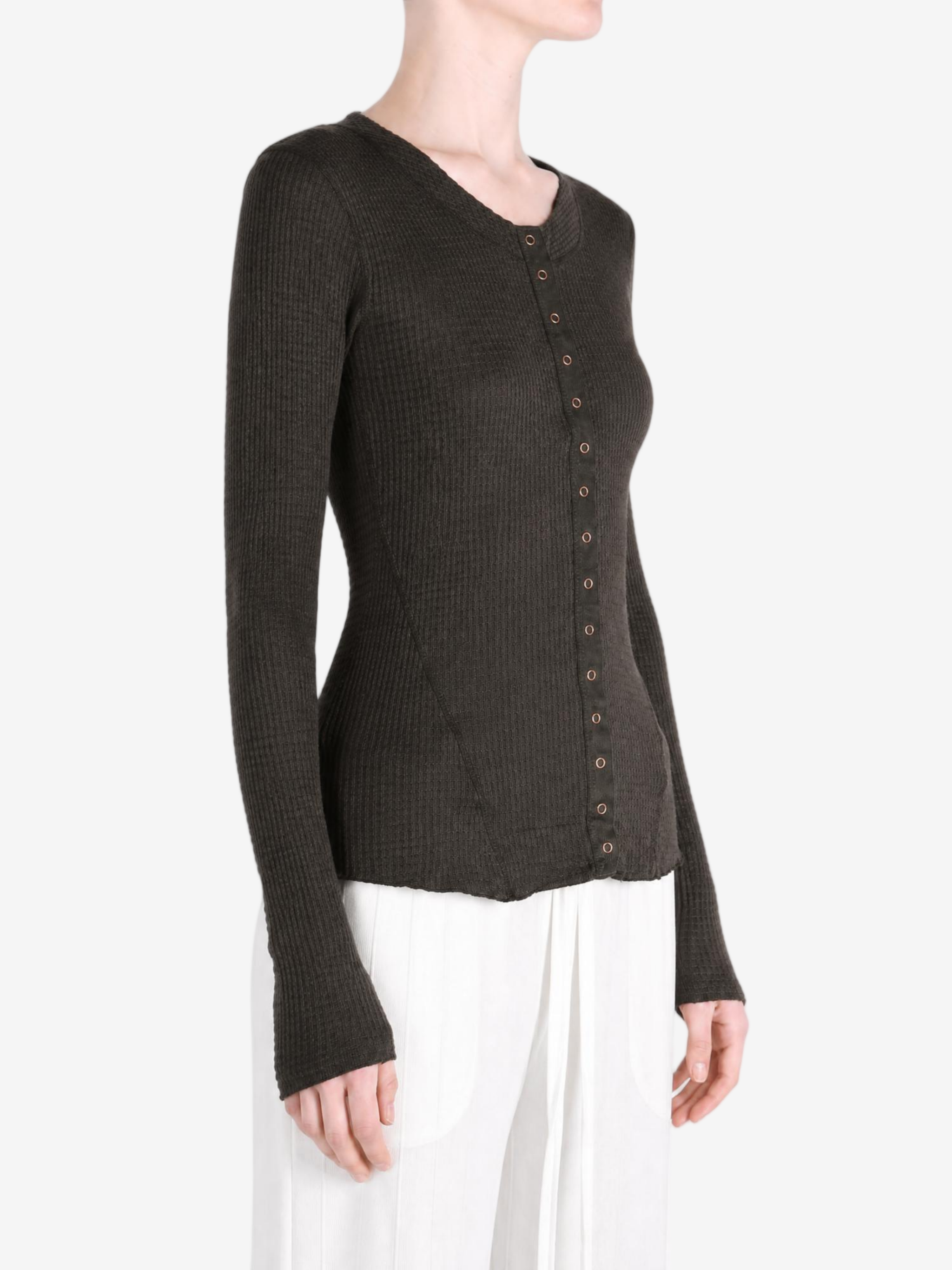 Brown knitwear worn by a person, showing the knitwear fit