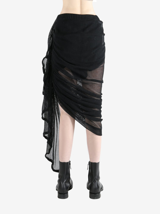 Black skirt worn by a person, showing the skirt fit