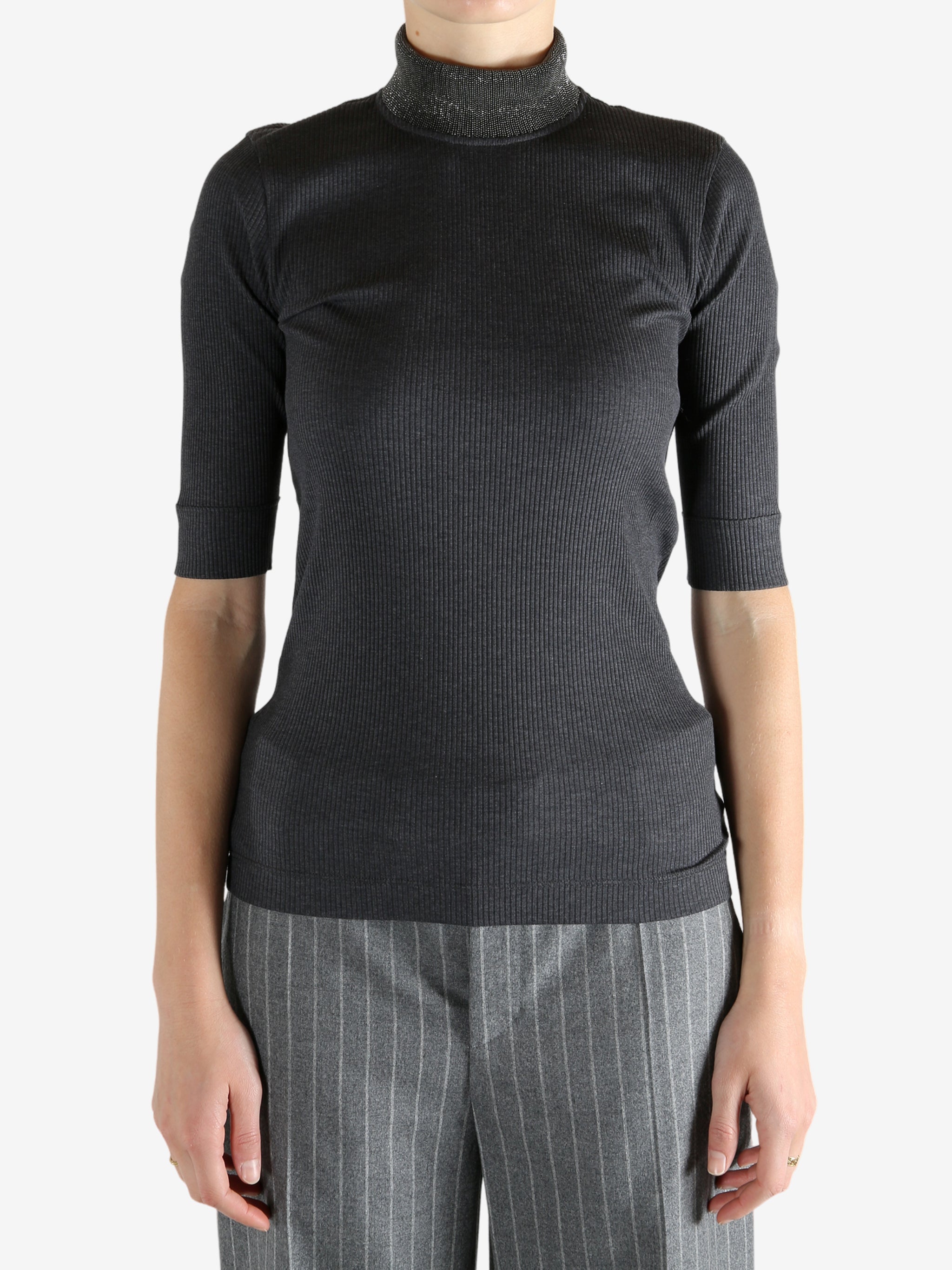 Grey tops worn by a person, showing the tops fit