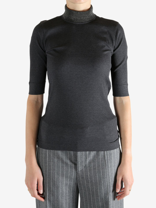 Grey tops worn by a person, showing the tops fit