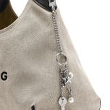 Close up of small accessories, showing texture of the zinc alloy fabric