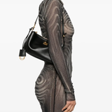 Black bag worn by a person, showing the bag fit