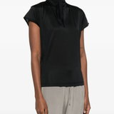 Black top worn by a person, showing the top's fit