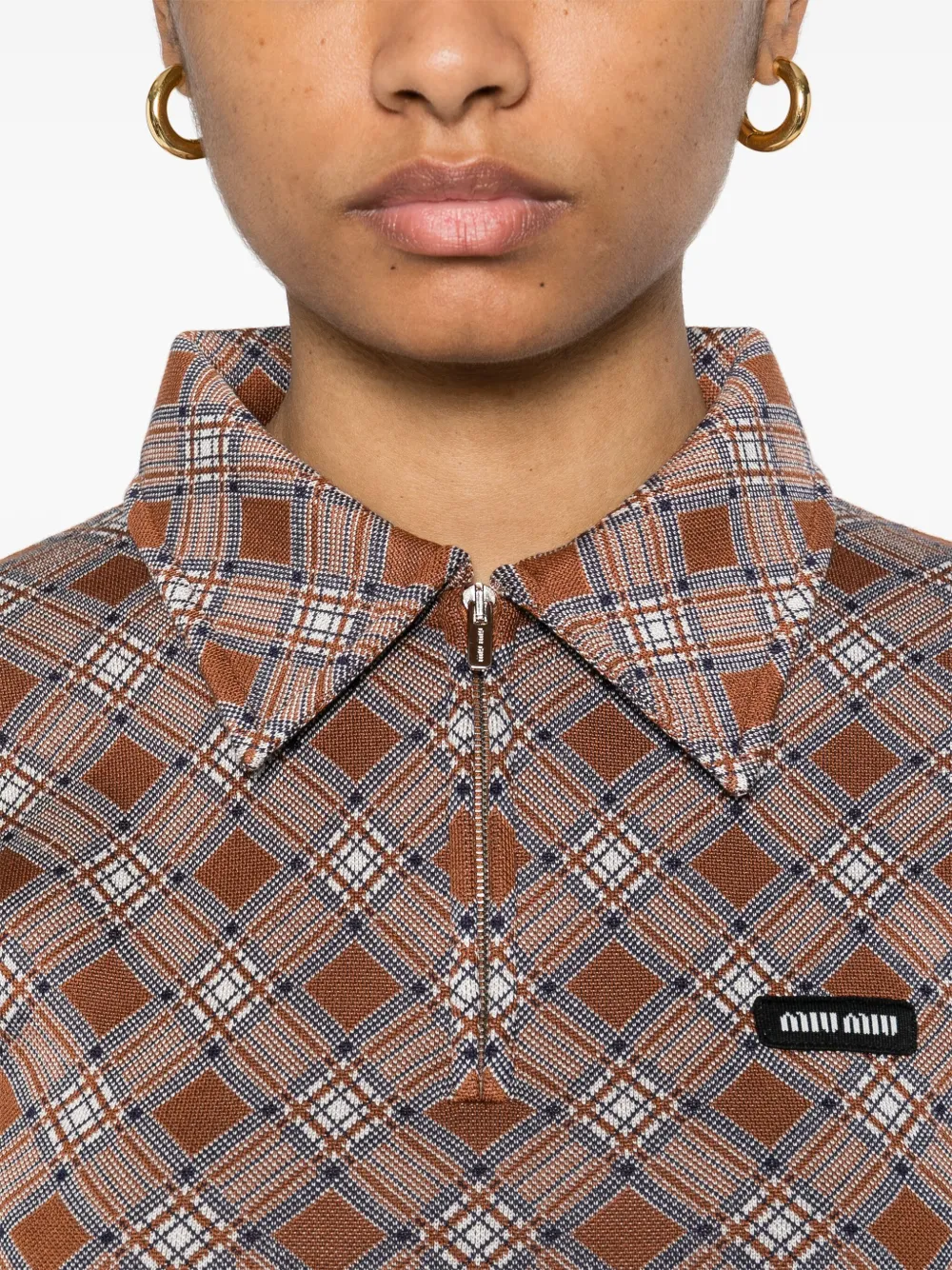 Close up of brown shirt, showing texture of the silk fabric