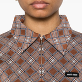 Close up of brown shirt, showing texture of the silk fabric