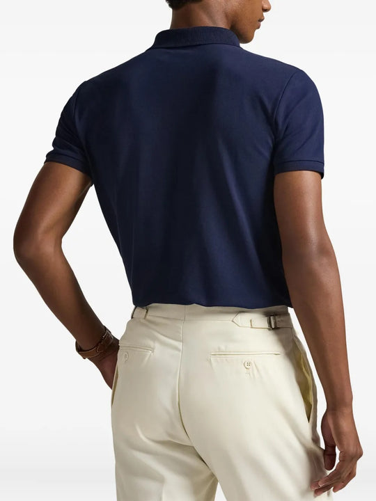 Navy shirt worn by a person, showing the shirt's fit