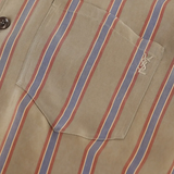 Close up of beige striped shirt,showing texture of the cupro fabric