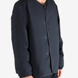 Navy cardigan worn by a person, showing the cardigan's fit
