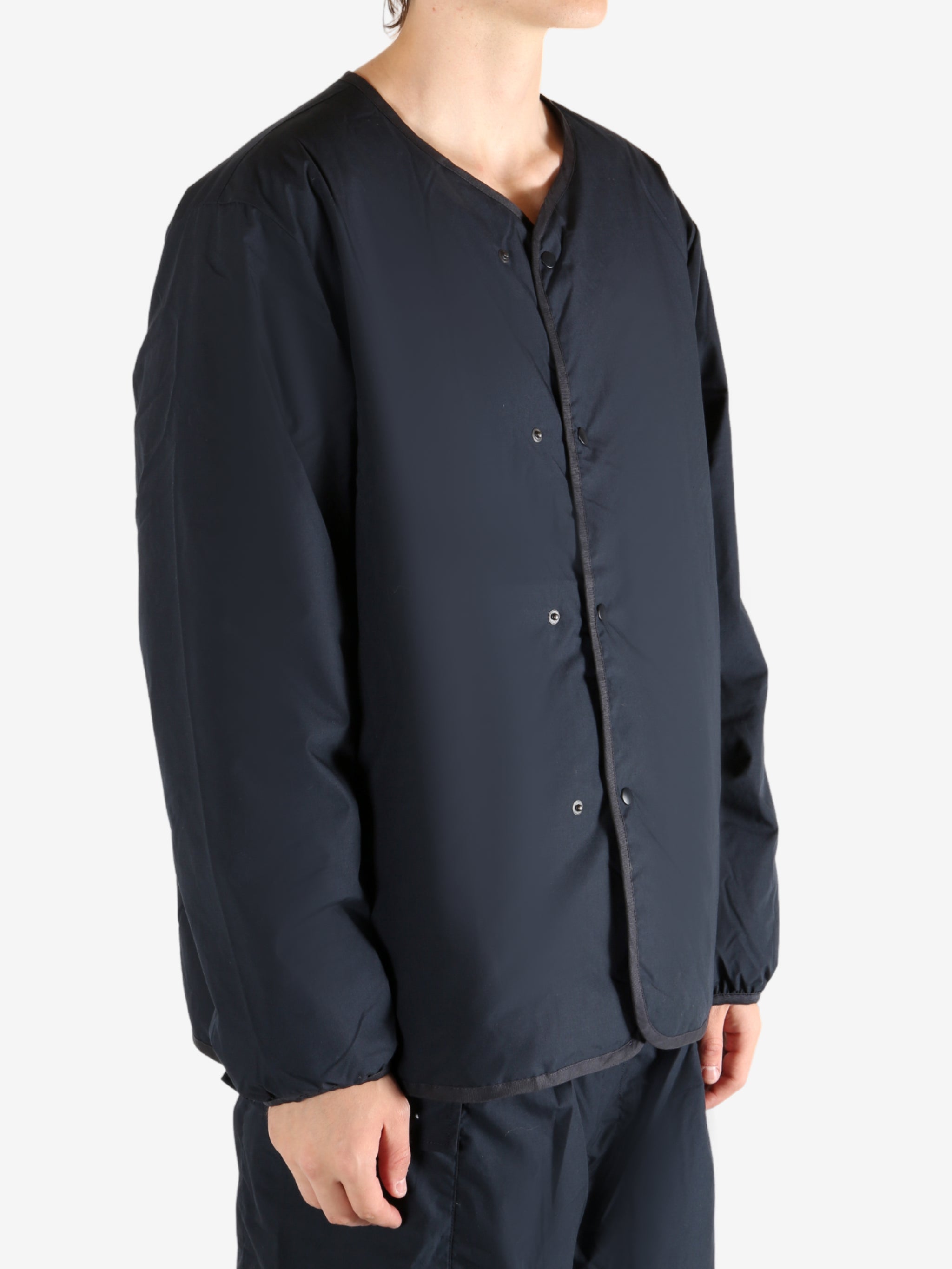 Navy cardigan worn by a person, showing the cardigan's fit