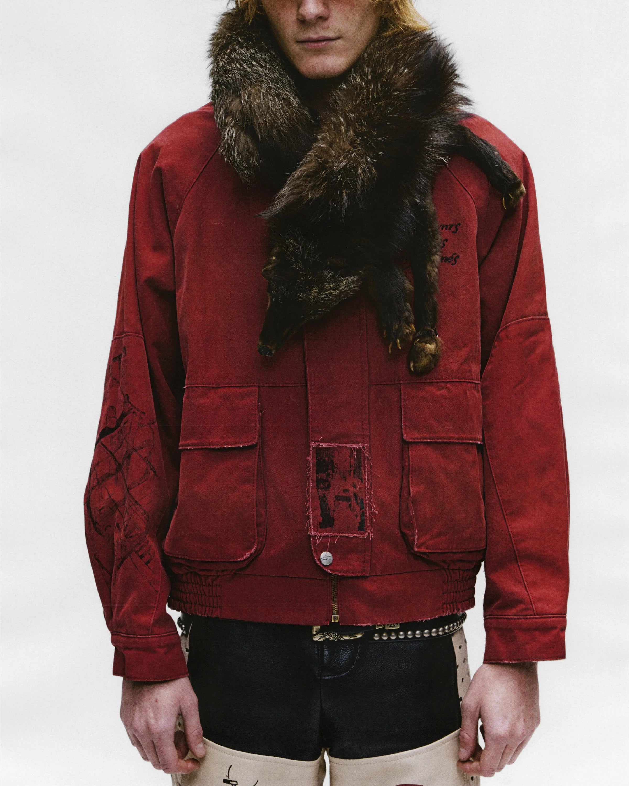 Red jacket worn by a person, showing the  jacket fit