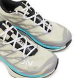 Close up of tan sneakers, showing texture of the polyester fabric