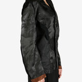 Black jacket worn by a person, showing the jacket's fit